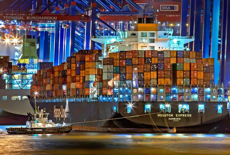 Container ships at sea representing the global shipping disruption caused by the Iran war and Strait of Hormuz blockade 2026