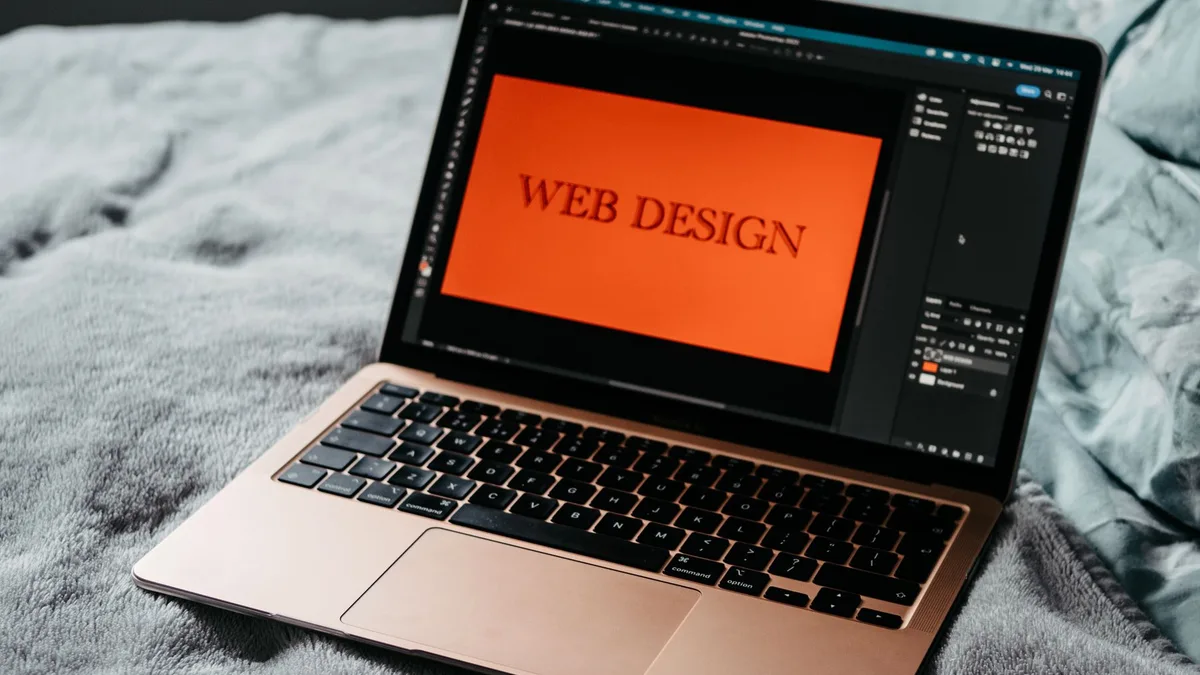 Laptop showing a web design workspace for AI website builder resources